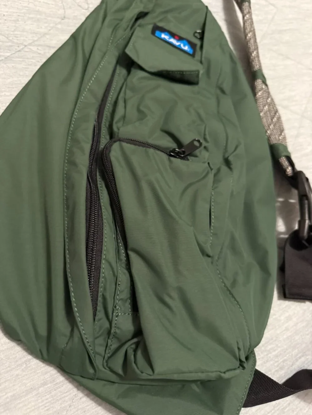 KAVU Rope Sling crossbody bag in a solid green colorway